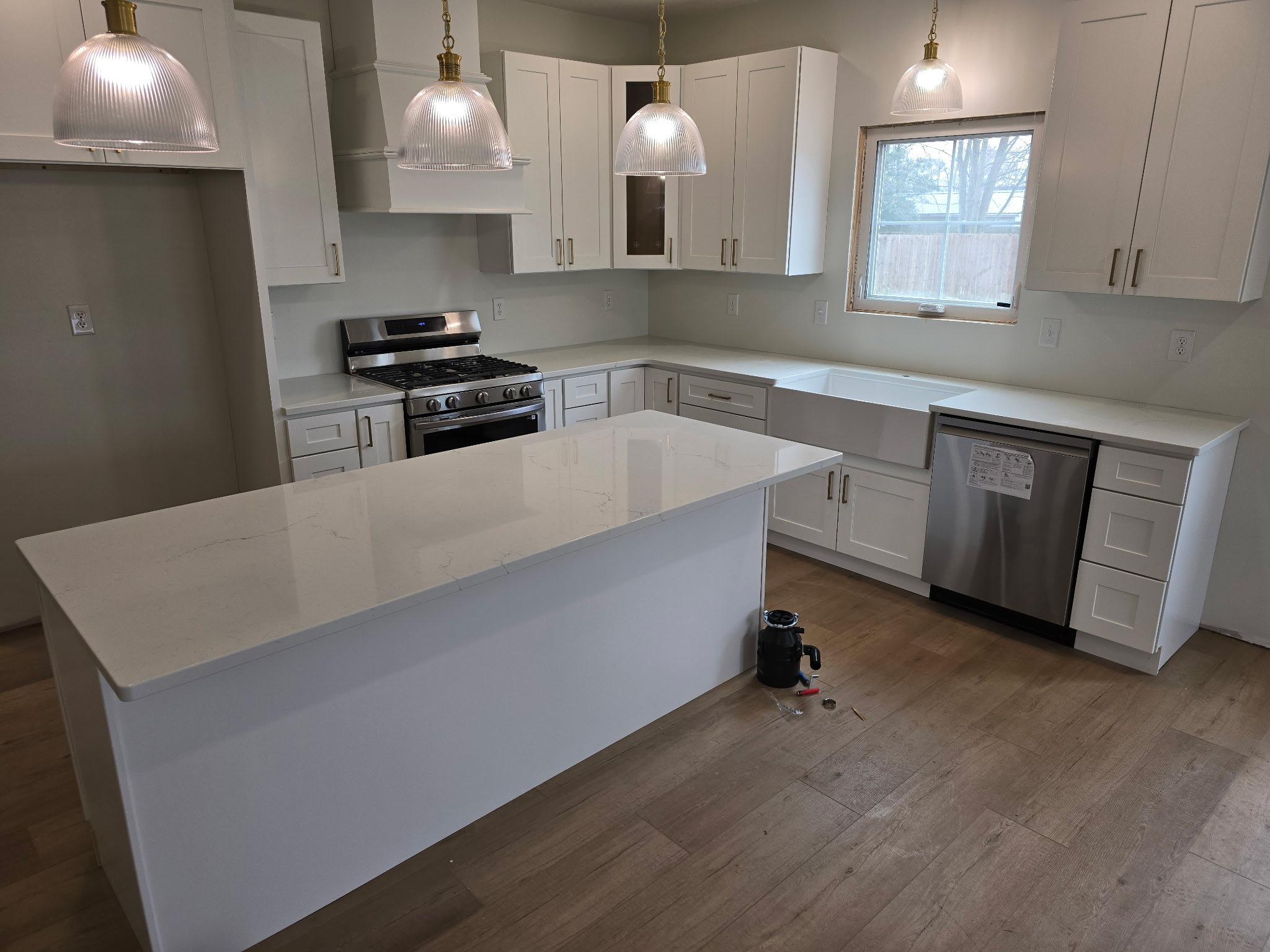 Home #6 kitchen, white shaker cabinetry with brass hardware
