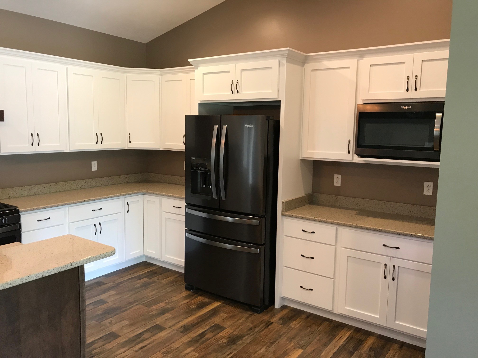 Home #8 kitchen, white cabinetry with black stainless appliances